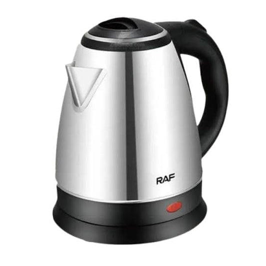 Electric kettle on its cordless base with steam rising as water boils