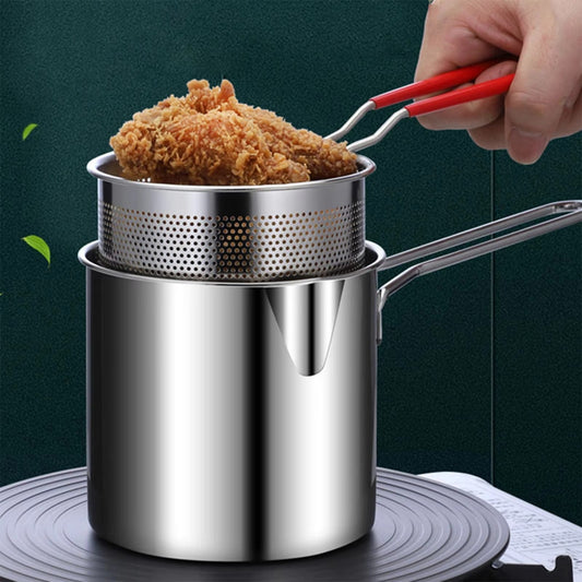 Strainer basket being lifted out of the stainless steel deep fryer pot